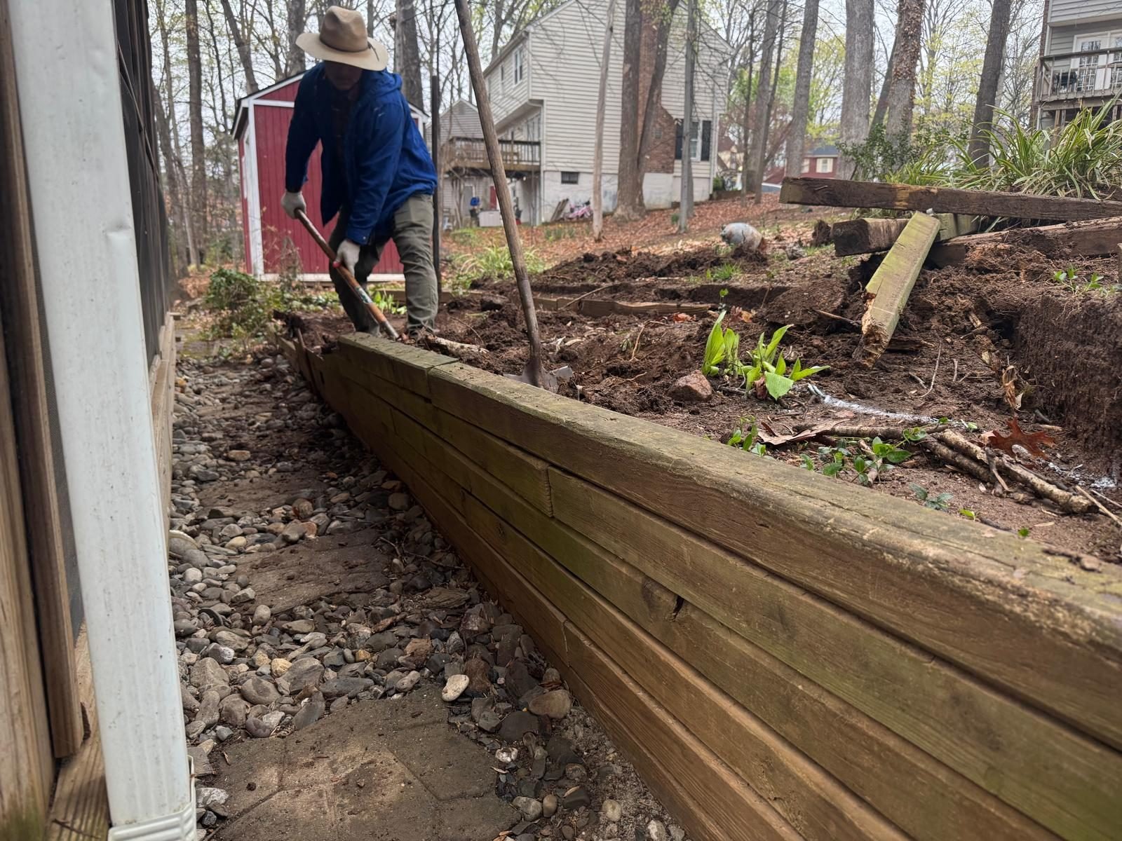 Building a wood retaining wall, board by board