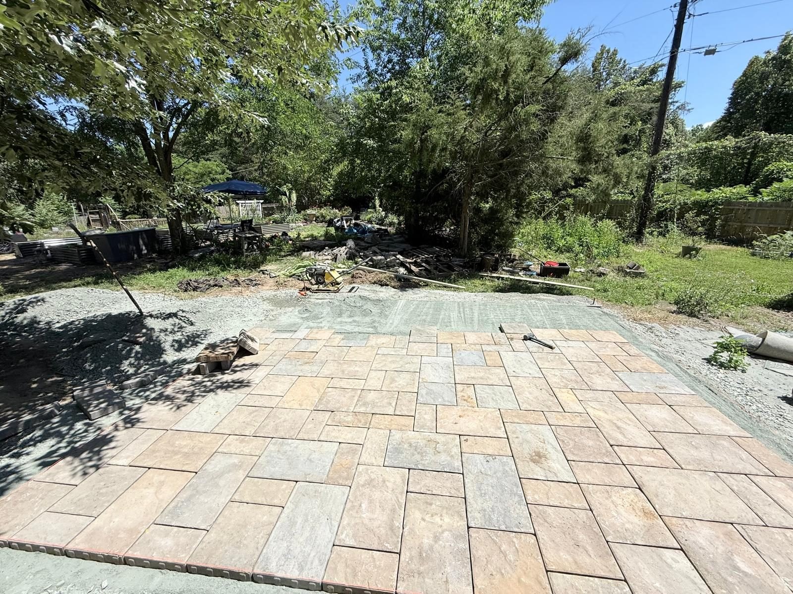 Flagstone patio finished in a shaded backyard