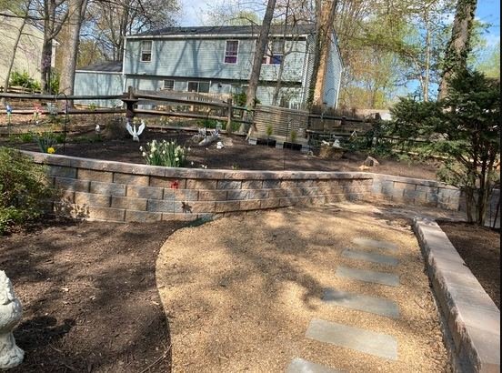Block retaining wall, raised garden bed and stepping-stone path