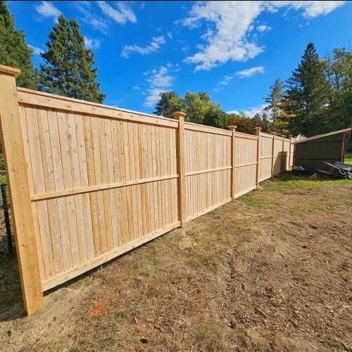 Newly installed wood privacy fence