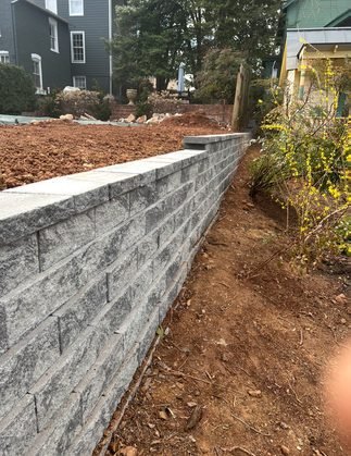 Gray block retaining wall, freshly built